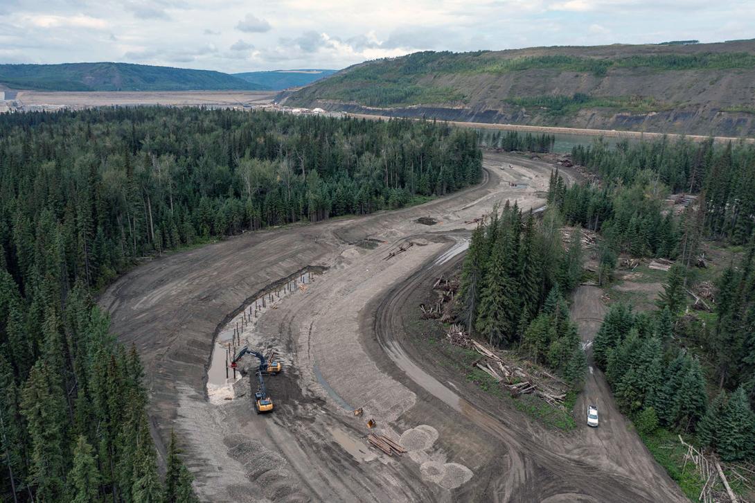 Engineered log jams are placed at intervals along the side channel. When the Site C dam is operational the water flowing through these channels will cover the log jams to provide fish habitat.