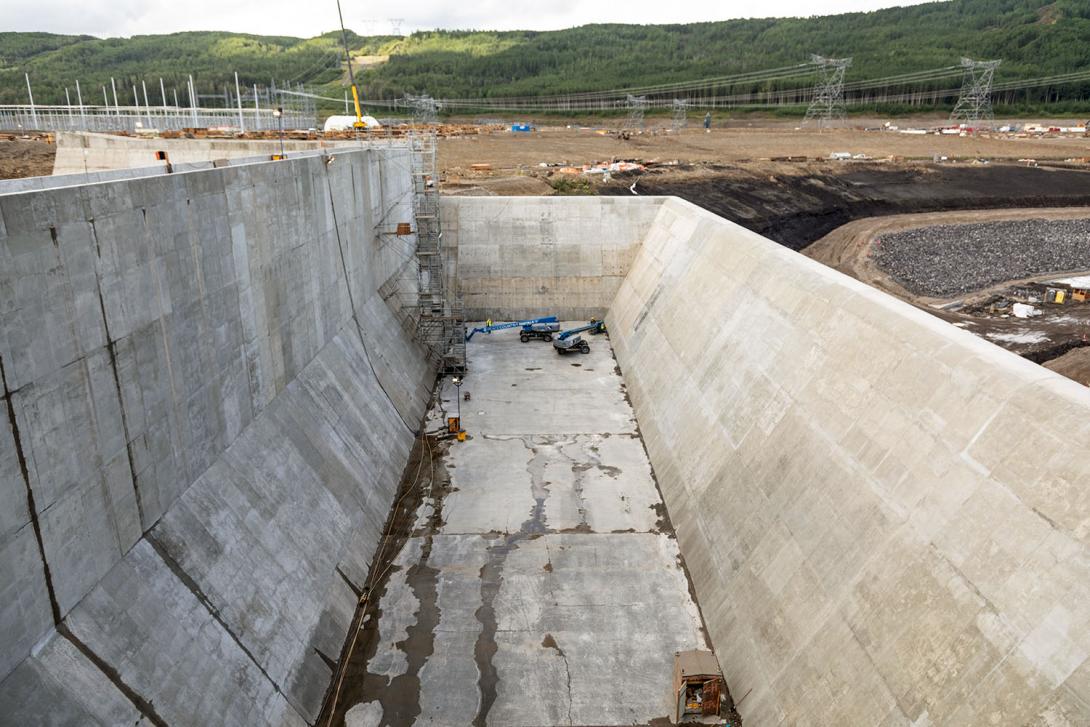 Concrete finishing will complete the basin of the auxiliary spillway. 