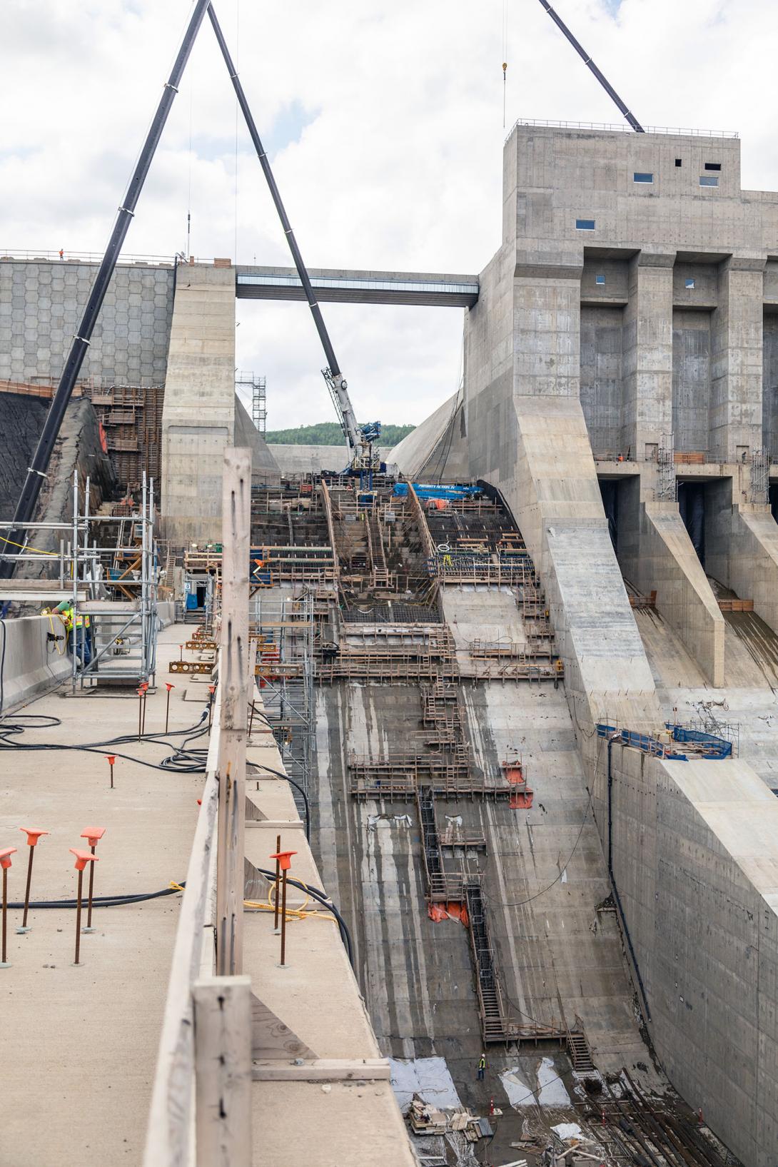 Formwork and reinforcing steel are installed on the auxiliary spillway chute.