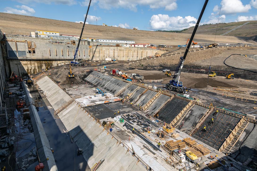 Formwork and reinforcing steel are placed for the concrete bench at the tailrace. This concrete will prevent the water from eroding the underlying material.