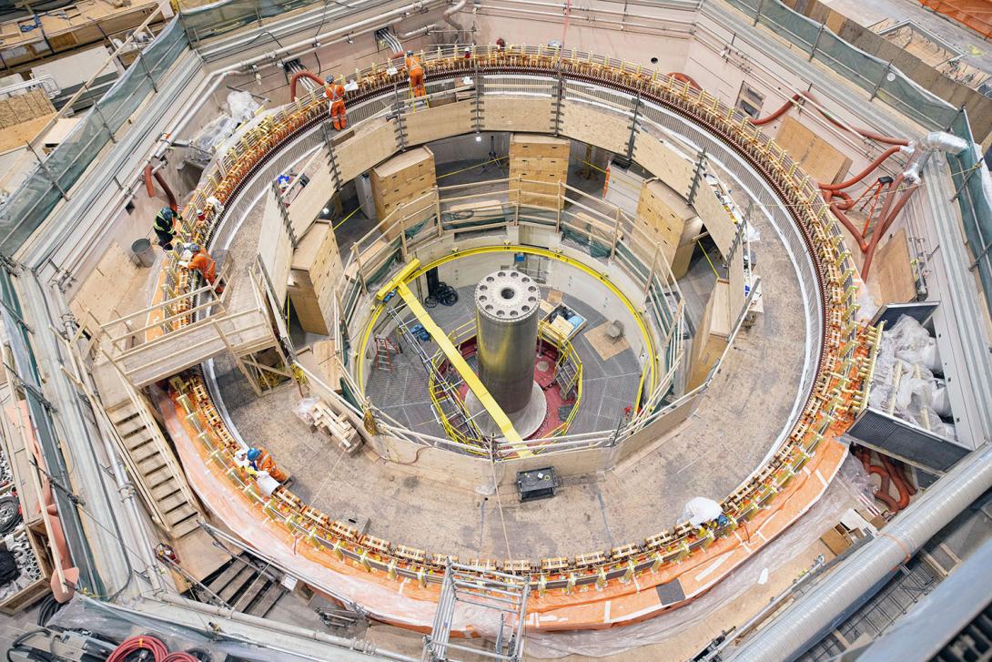 Work on turbine unit 2 is ongoing with the installation of the bottom ring runner and turbine shaft, and stator stacking.