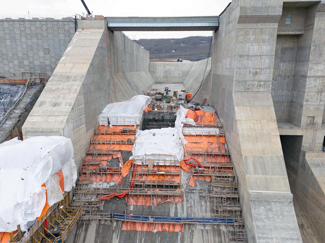 The auxiliary spillway nears completion with final concrete placements. | November 2023