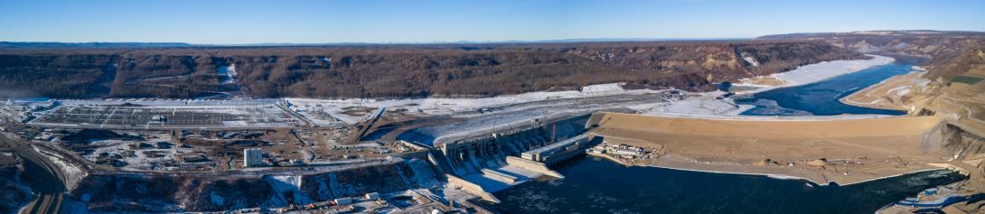 The Site C general arrangement, including the sub-station and 500 kilovolt transmission right of way, at left, the approach channel behind the powerhouse and generating station, and the completed dam at centre right.