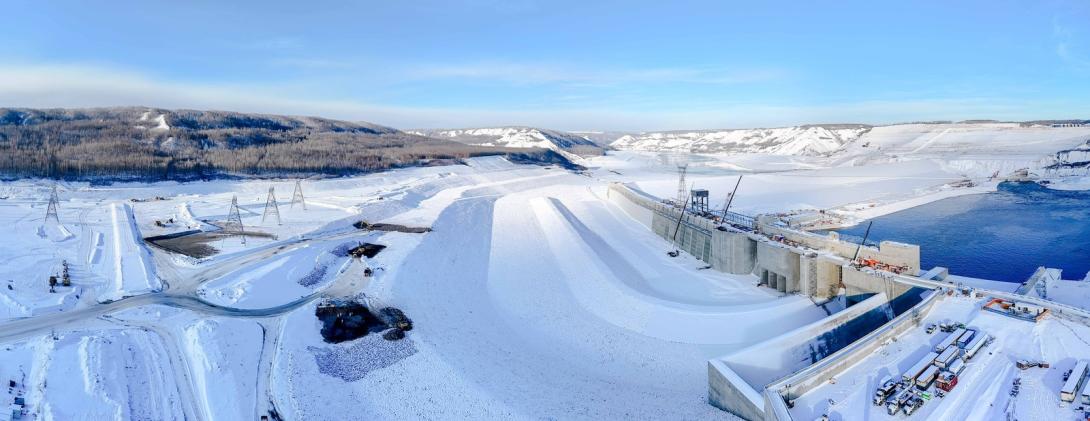 Water will flow down the approach channel to the dam intakes. The excavation in the lower left is exposed bedrock that will be covered with riprap. 