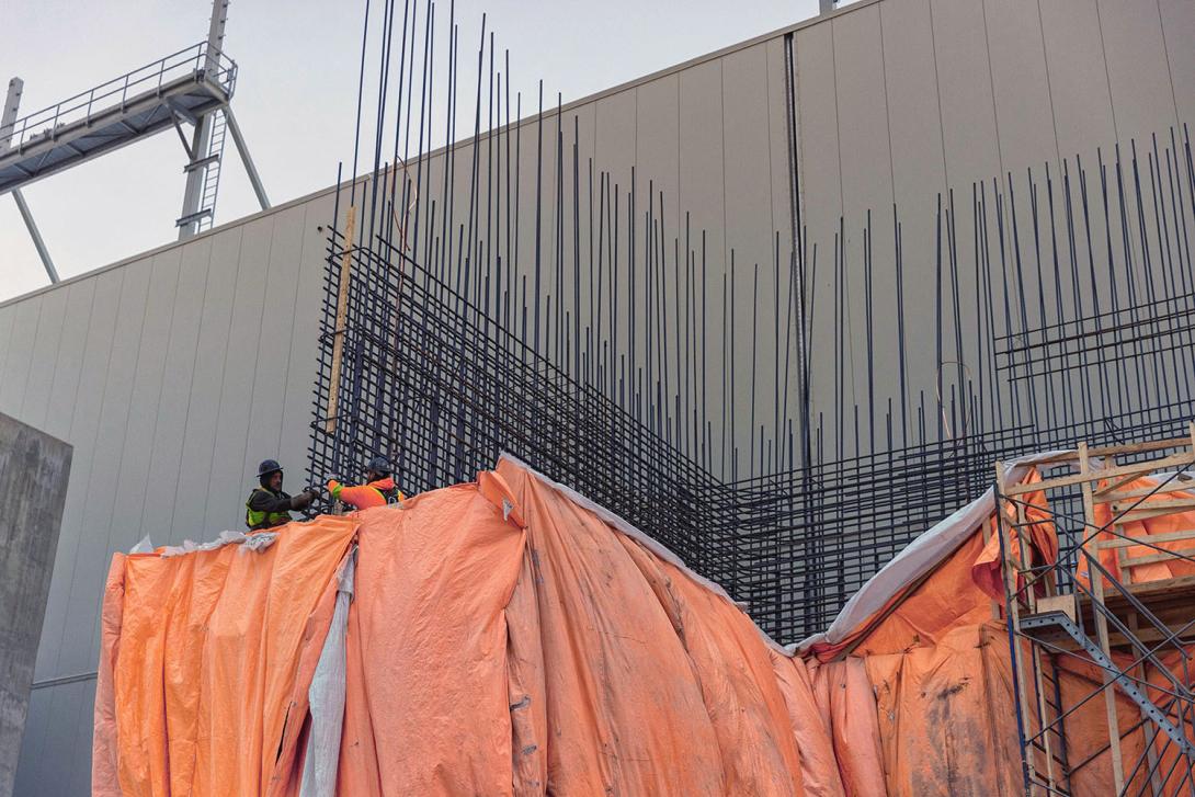 Installing rebar framing for the second of three transformer pads and blast walls. These walls are designed to contain fire and protect neighboring units. | March 2024