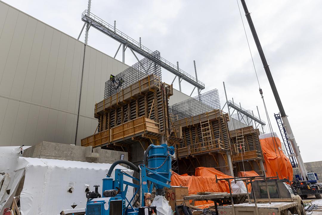 Rebar framing is installed for the second of three transformer pads and blast walls. These walls are designed to contain fire and protect neighboring units. | March 2024
