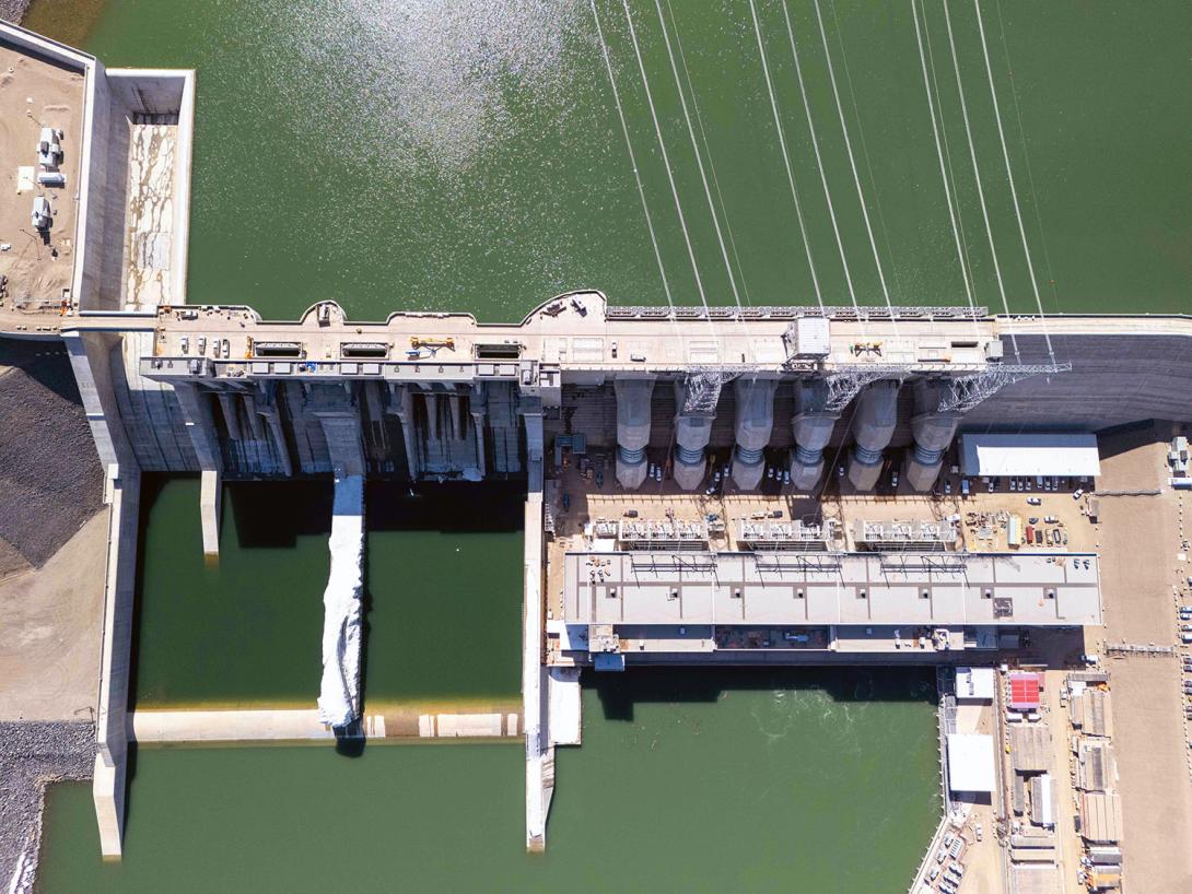 Aerial view of the generating station with the approach channel at the top and the river at the bottom of the photo. | April 2025