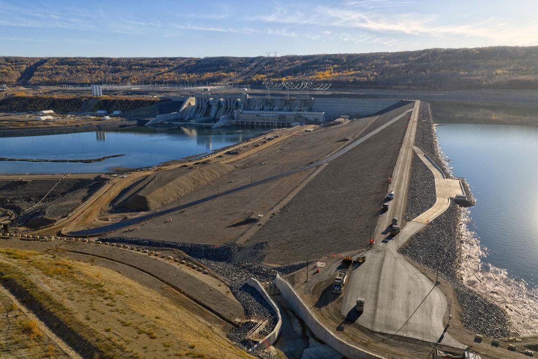 Paving is completed on the dam crest, and on the diagonal access road, visible on the face of the dam. | October 2025