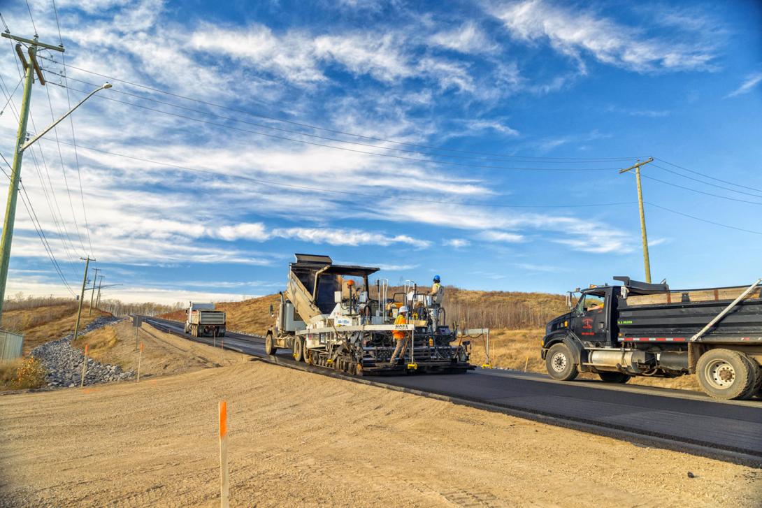 Placing the second lift of pavement on the access road near Gate A. | October 2025